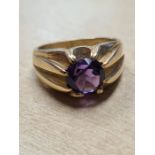 9ct yellow gold signet ring with large central round cut faceted amethyst in 8 claw mount, size R, m