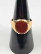 18ct yellow gold signet ring with oval Carnelian panel, size N, marked 18ct, approx 5.2g