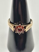 9ct yellow gold garnet cluster ring, with feathered design to shoulders, size P, approx 1.57g, marke