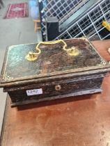 A late 19th Century, small Chubb tin safe the outside having simulated wooden effect