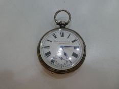 A Victorian silver pocket watch having engine turned design and a central vacant cartouche. the inte