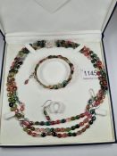 A beautiful multi-coloured tourmaline three row necklace, with 18K white gold clasp and two x framed