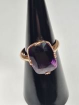 Rose gold dress ring set with a large faceted amethyst in 4 claw mount, size M, unmarked, approx 5.3
