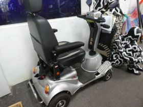 A Quingo plus Mobility Scooter, with charger, and related ephemera, appears in working condition