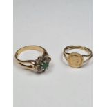9ct gold ring with split shoulders and curved coin Maximilano Empradon together with an emerald and