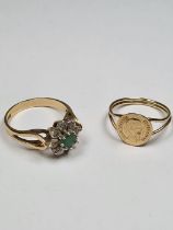 9ct gold ring with split shoulders and curved coin Maximilano Empradon together with an emerald and