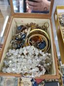 Jewellery box containing various necklaces, compacts including Yves Saint Laurent example, another b