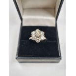 18ct white gold diamond cluster ring, in the form of a daisy head, central diamond approx 0.3 carat,