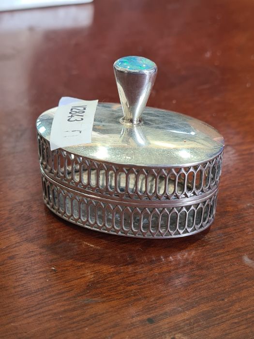 A white metal oval cricket holder having pierced sides - Image 2 of 2