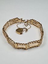 9ct yellow gold 4 bar gatelink bracelet, with heart shaped padlock clasp and safety chain, marked 37