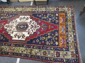 An Anatolian Taspinar woollen rug, having central motif with geometric border, 297 x 162cms