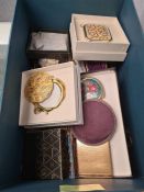 Box of vintage compacts and fans