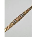 9ct tri-gold bracelet with graduating alternating coloured panels, marked 375, approx 5.48g