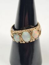 9ct yellow gold dress ring set with 3 opals, separated with small diamond chips, size M, marked 375,