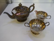 A silver three piece tea service by Harford Case Co. Having beaded design rim and foot. Comprising a
