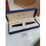 A modern black and gilt Waterman fountain pen in case