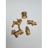 Five 9ct yellow gold charms to include pig, owl, Scottie dog, Poodle and letter box, all marked 375,
