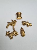 Five 9ct yellow gold charms to include pig, owl, Scottie dog, Poodle and letter box, all marked 375,