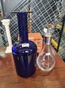 A large Holmeguard Bristol blue bottle and a decanter having silver collar, by Carr's