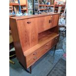 A 1970s G-Plan style wall cupboard having 2 long drawers