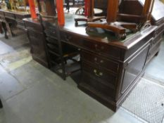 A large reproduction mahogany twin pedestal desk having 8 drawers, 183cm