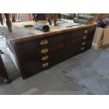 An oak 4 drawer plan chest having later stripped top