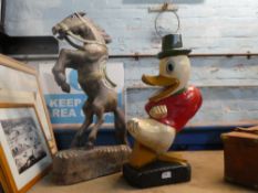A wooden carved figure of rearing horse and one other Donald Duck
