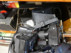 Three trays of cameras, lenses and similar
