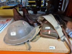 A quantity of military belts, shoes, water bottle, pistol holsters, a helmet and sundry