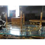 A similar oval coffee table having glass top, 113cm