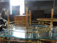 A similar oval coffee table having glass top, 113cm