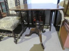 An antique tripod table having oblong top and two other items