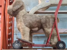 A Lines Brothers (Triang) vintage push along dog and a vintage wooden rocking horse (A/F)