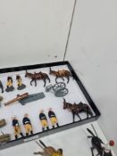 A quantity of vintage Britains lead soldiers to include Canadian Mounted Police, Scots Guards, Benga