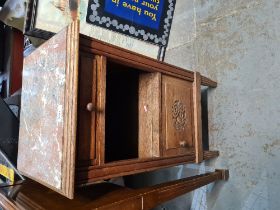 A French oak bedside cupboard having rouge marble top