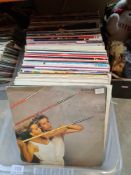 Two cartons of vinyl LP records, mainly 80s and a small quantity of 7 inch singles (2 boxes)