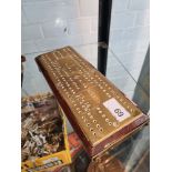 A pre World War I era Brass Cribbage board, stamped HMS Minataur, China and Japan 1912, 13 & 14