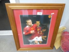 A signed Wayne Rooney Manchester United football shirt with certificate and a coloured photograph