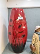 A modern Poole vase decorated butterfly and flowers, the body red glazed 38cm