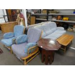 An Ercol light blonde stickback 3 seat settee and a pair of matching armchairs