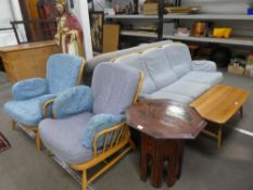 An Ercol light blonde stickback 3 seat settee and a pair of matching armchairs