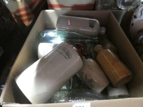 A box of mixed stoneware and glass bottles, etc including some marked Timothy Whites and Taylor's Ch