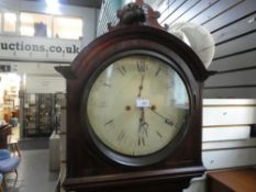 A 19th Century, mahogany long case clock having round painted dial