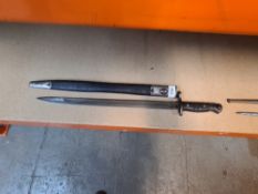 A British military bayonet stamped 1913, with leather scabbard