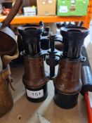 An old military gun sighting telescope and 6 pair of binoculars, mainly military