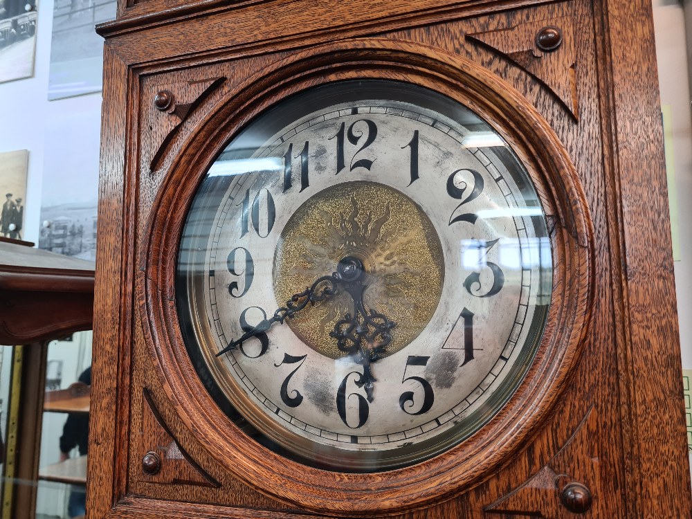 A 1920s oak longcase clock having round dial, 8 day, the glazed door having fretwork decoration, 220 - Image 2 of 5