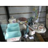 A shelf of Poole Pottery items