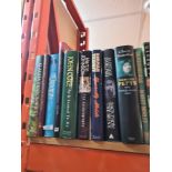 A shelf of books including biographies