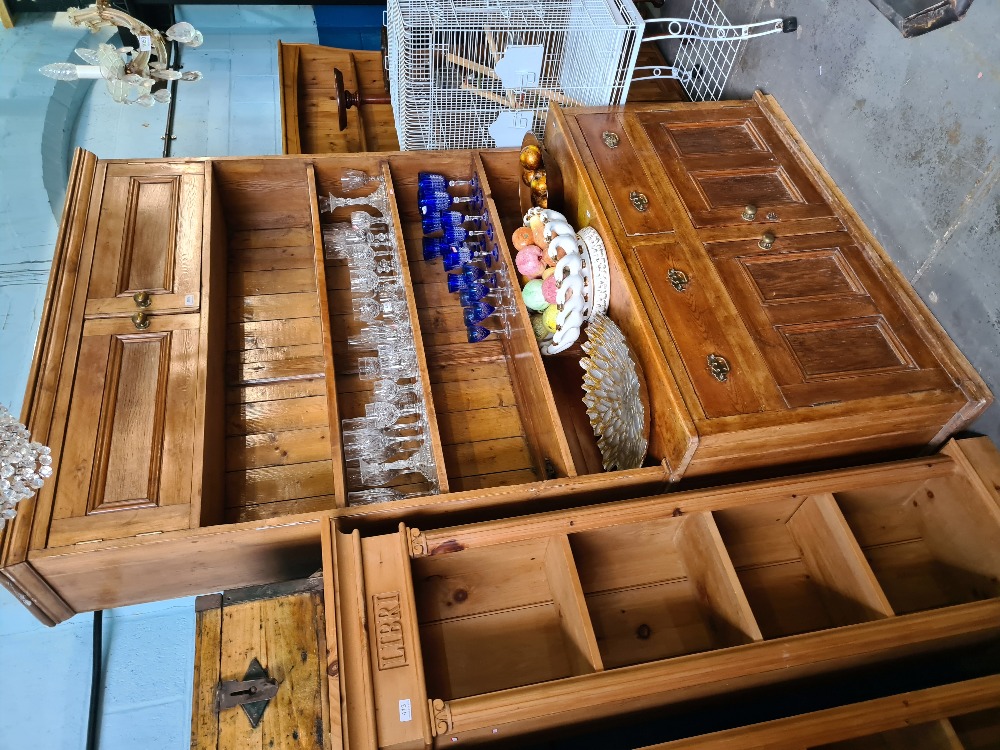 An old stripped pine dresser, the rack back having top cupboard