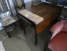 A Victorian mahogany Pembroke table having one drawer